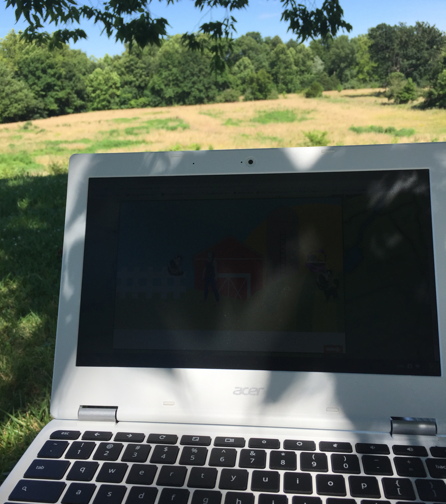 Chromebook next to field east of Warrensburg