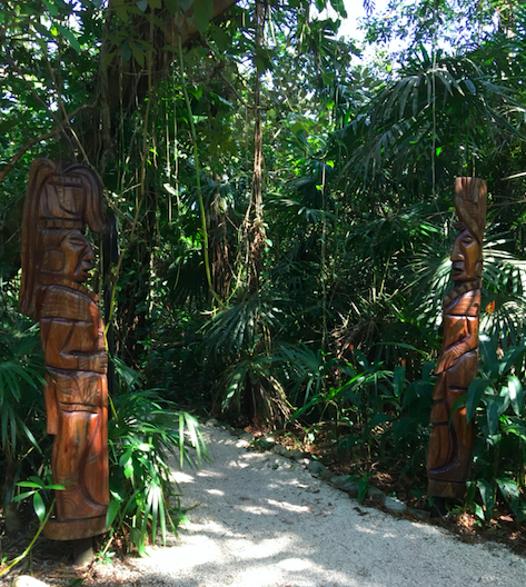 Wood carvings leading to a jungle path