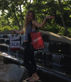 Julia holding shopping bag