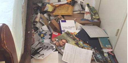 room floor covered in books and other crap