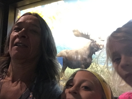 Me, 2 granddaughters and a moose