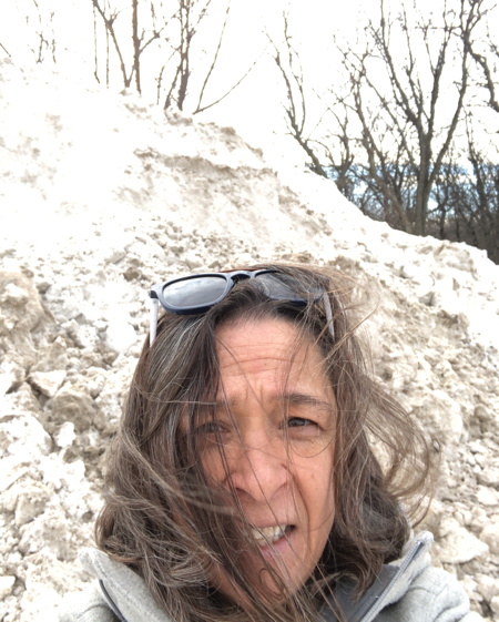 me in front of a pile of snow
