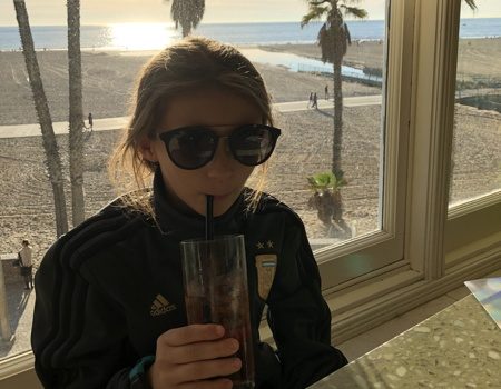 Eva wearing her shades and drinking a Roy Rogers