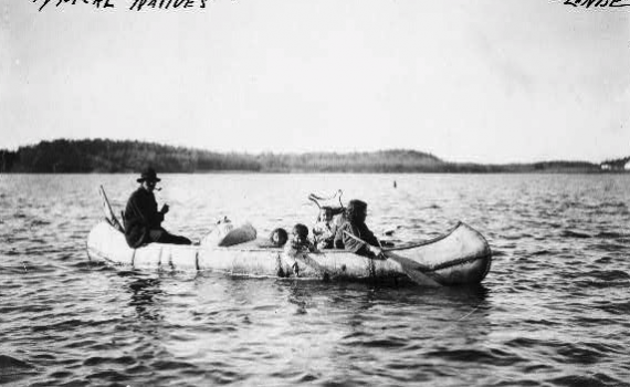 Ojibwe men in canoe - photos are a good primary resource for teaching Ojibwe history