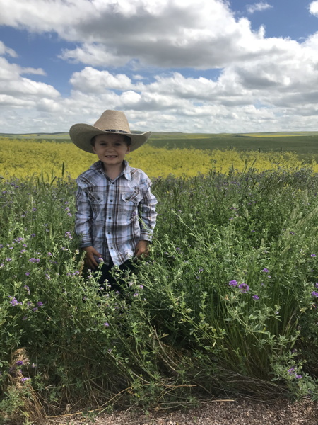 Dressed in cowboy hat, western shirt and boots, 2 days into the trip moving our startup to the midwest